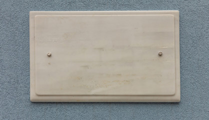 Blank empty ceramic street sign on a plastered wall, copy space, banner. Mdina, Malta