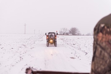 tractor vehicle on snowy winter road