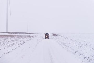 tractor vehicle on snowy winter road