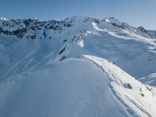 Fototapeta na wymiar Aerial view of snow covered mountain peak in swiss alps