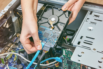 Connecting hard drive unassembled to desktop computer.