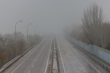 old road in a foggy day