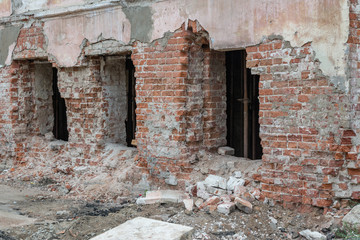 The destroyed wall of a brick house