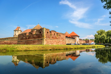 Fototapeta na wymiar An amazing castle with water reflection in Romania