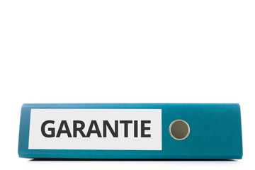 blauer liegender Aktenordner mit Beschriftung Garantie vor hellem Hintergrund
