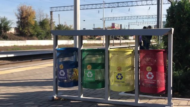 The Separation Of Garbage Waste In Plastic, Paper, Metal, bins for separate waste. Garbage separation bins for separate waste collection railway station, city, railway, Russia