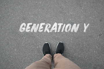 Top View of Leg and Shoes on the Street  with  Generation Y Text