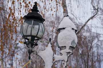 Street light covered by snow.