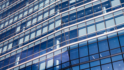 Blue Business Building. An angular and abstract full frame view of the windows to a generic contemporary office building.