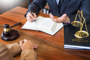 lawyer in office. Counseling and giving advice about legal legislation in courtroom to help...