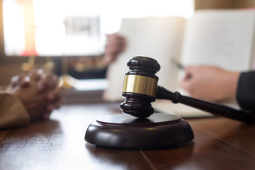 lawyer in office. Counseling and giving advice about legal legislation in courtroom to help...