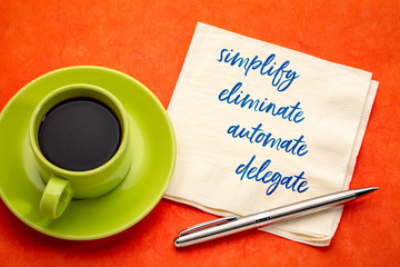 simplify, eliminate, automate, delegate concept on napkin