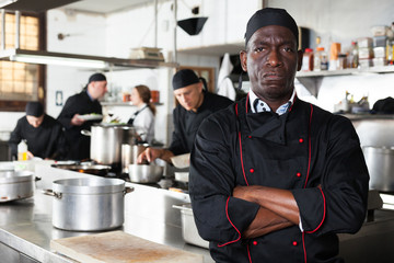 Dissatisfied african american male chef in kitchen of restaurant