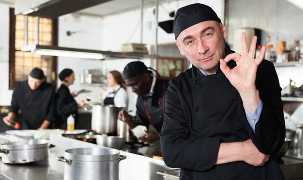 Professional male chef in kitchen of restaurant