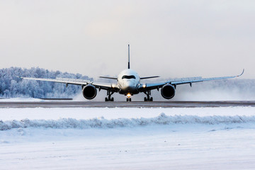 Modern commercial passenger plane on airfield. Jet on runway. Aviation and transportation.