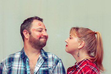 Loving couple on a gray background.