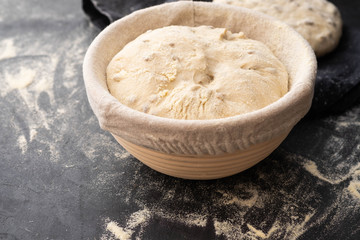 Balls of dough covered with wheat flour ready for baking. Copy space.