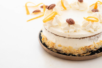 Vegan, raw carrot cake. Healthy food. White stone background. . Copy space.