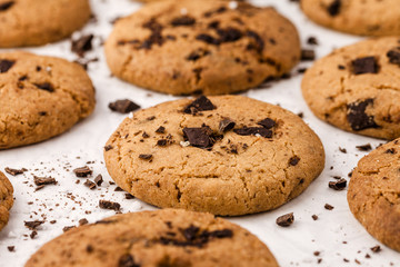 Homemade chocolate chips cookies on white background, top view