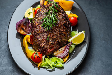Club Beef steak with pepper sauce and Grilled vegetables on dark wooden background. Roas beef. Copy space.