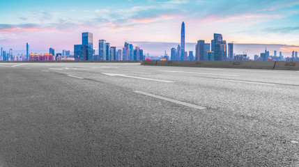 Empty asphalt road along modern commercial buildings in China,s cities