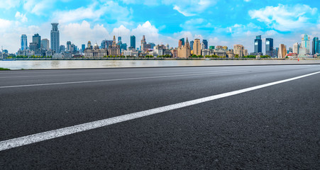 Empty asphalt road along modern commercial buildings in China,s cities
