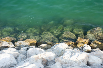 rocks of beach with sea