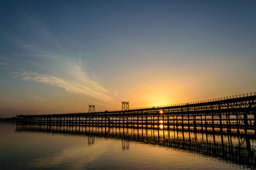 Fototapeta na wymiar Sunset over the Rio Tinto Pier, Huelva, Andalusia, Spain