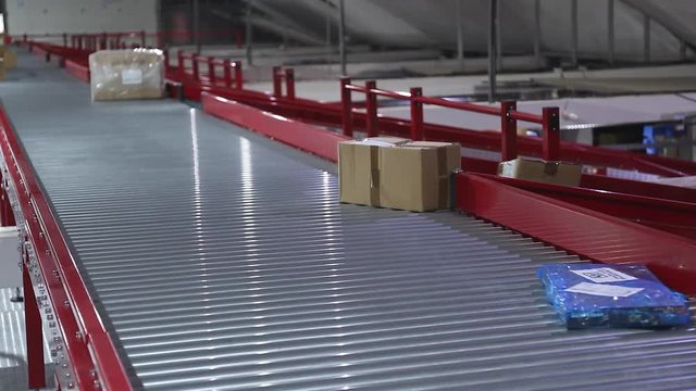 Conveyor Belt in Shipping Distribution Depot Warehouse