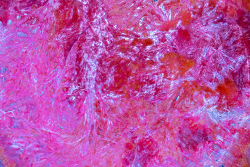 Abstract pattern in red crystallized salts