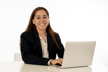 Happy successful young woman working on laptop