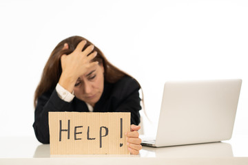 Sad and tired businesswoman holding a help sign feeling helpless and frustrated