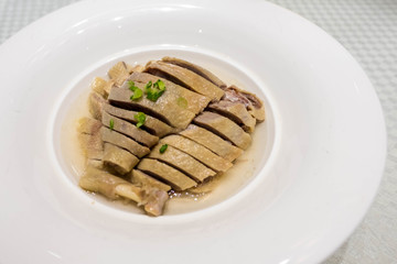 Drunken Chicken plated on a circular dish