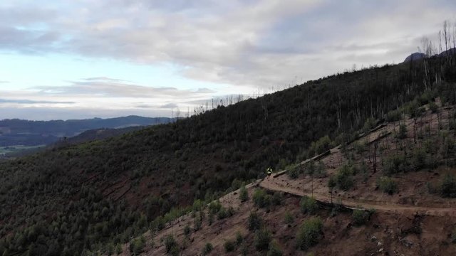 aerial view of a trail runners on a mountain with beautiful landscape