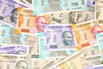 Close up view of brand new indian 10, 50, 100, 200, 500 and 2000 rupees banknotes. Colorful money background.