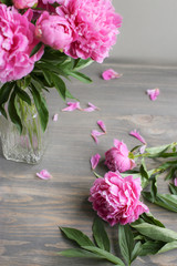 Flowers composition.  Pink peony flowers on wooden background. Mothers day. Flat lay, top view.