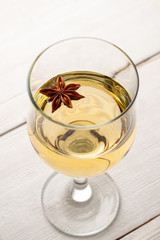 Glass of white wine on vintage wooden table