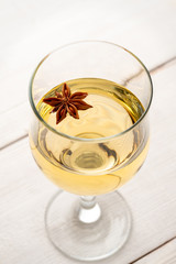 Glass of white wine on vintage wooden table