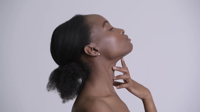 Face of young beautiful African woman shirtless as beauty concept