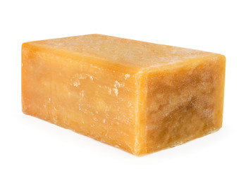 A piece of Laundry soap closeup on a white. Isolated.