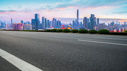 Empty asphalt road along modern commercial buildings in China,s cities