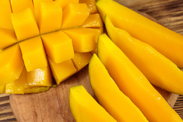 Fresh mango fruit on wooden table