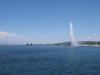 Beautiful water jet on Geneva european city promenade at swiss Leman Lake landscape in Switzerland