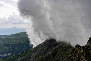 Heavy rain over mountains. Stormy weather.
