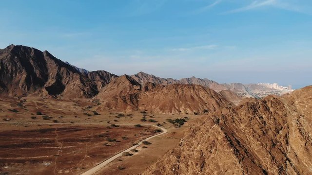 AERIAL. Top view of Road between mountains in UAE