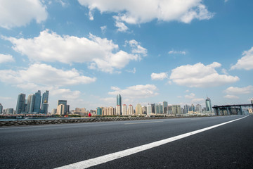 Empty asphalt road along modern commercial buildings in China,s cities