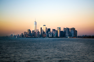 Approaching the Lower Manhatten skyline at sunset from Staten Island, New York City, United States