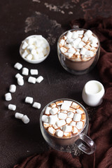 Glass cup of hot chocolate or cocoa drink with marshmallows. Traditional winter or autumn hot drink. Holiday concept, Selective focus.