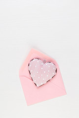 Valentine's Day background.  Letter on white background. Valentines day concept. Flat lay, top view, copy space.