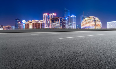 Road Pavement and Night View of Hangzhou Urban Architecture..